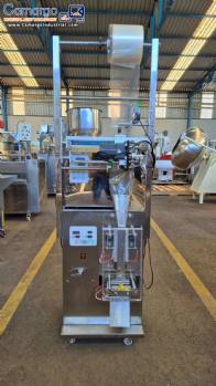 Dosing and packaging machine for granular and powdered products